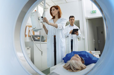 Medical Professional preparing a patient to under go a PET-CT scan.